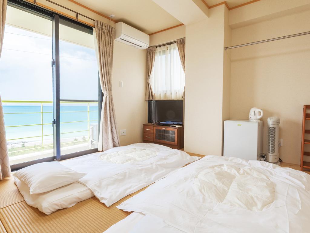 Kin Kariyushi Condominium Ocean Hills Chouraku Stay מראה חיצוני תמונה